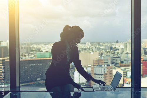 Silhouette of businesswoman work