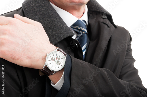 Close-up of elegant man hand wearing wrist watch