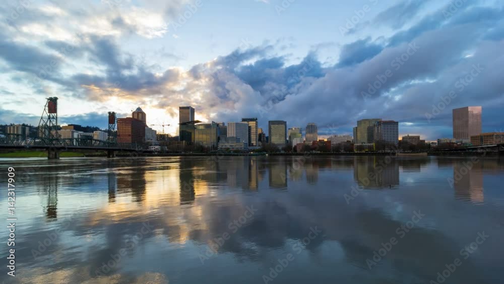 Dramatic clouds and sky moving over downtown Portland Oregon with water reflection along Willamette River waterfront at sunset into blue hour 4096x2304 4k ultra high definition time lapse Dramatic clouds and sky moving over downtown Portland Oregon with water reflection along Willamette River waterfront at sunset into blue hour 4096x2304 4k ultra high definition time lapse