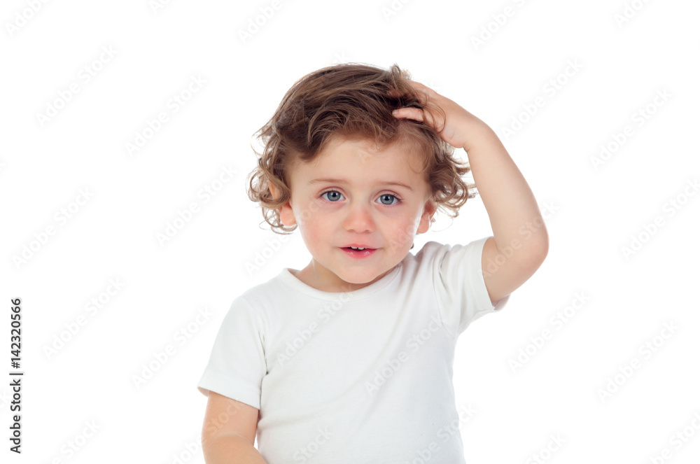 Baby with blue eyes touching his head Baby with blue eyes touching his head