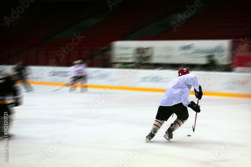 Hockey player in generic white equipment