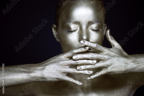 Portrait unearthly silver girls, hands near the face. Very delicate and feminine. The eyes are closed.Frame of hands