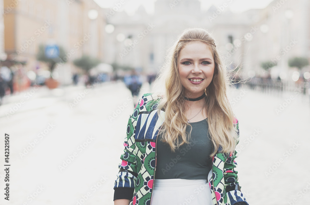Happy young hipster woman in Rome
