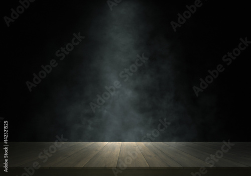 Spotlight and smoke on wooden stage