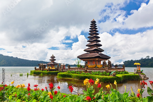Temple Pura Ulun Danu Beratan. Traditional Balinese temple on lake. Place of festivals, famous travel attraction, day tour destination in Bali island, Indonesia. Indonesian people culture background.