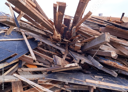 Pile of wooden planks at demolition site ready the recycling