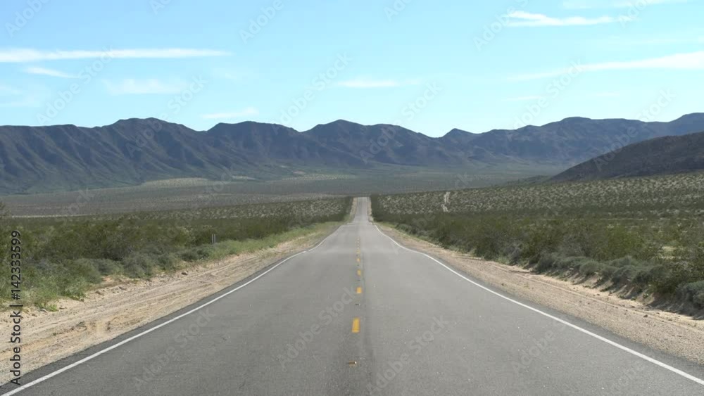 Zoom Out of Scenic Empty Desolated Road in the Mojave Desert Zoom Out of Scenic Empty Desolated Road in the Mojave Desert