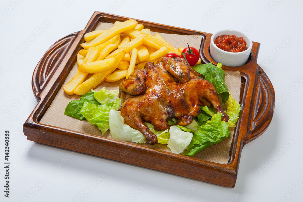 Chicken with potato and other vegetables on pan. Chicken with potato and other vegetables on pan.