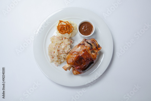 Canvas Print baked pork knuckle served with braised cabbage