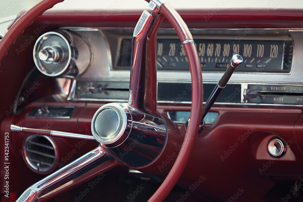 Close up on a dashboard of a vintage car,fragment of interior retro car with speedometer
