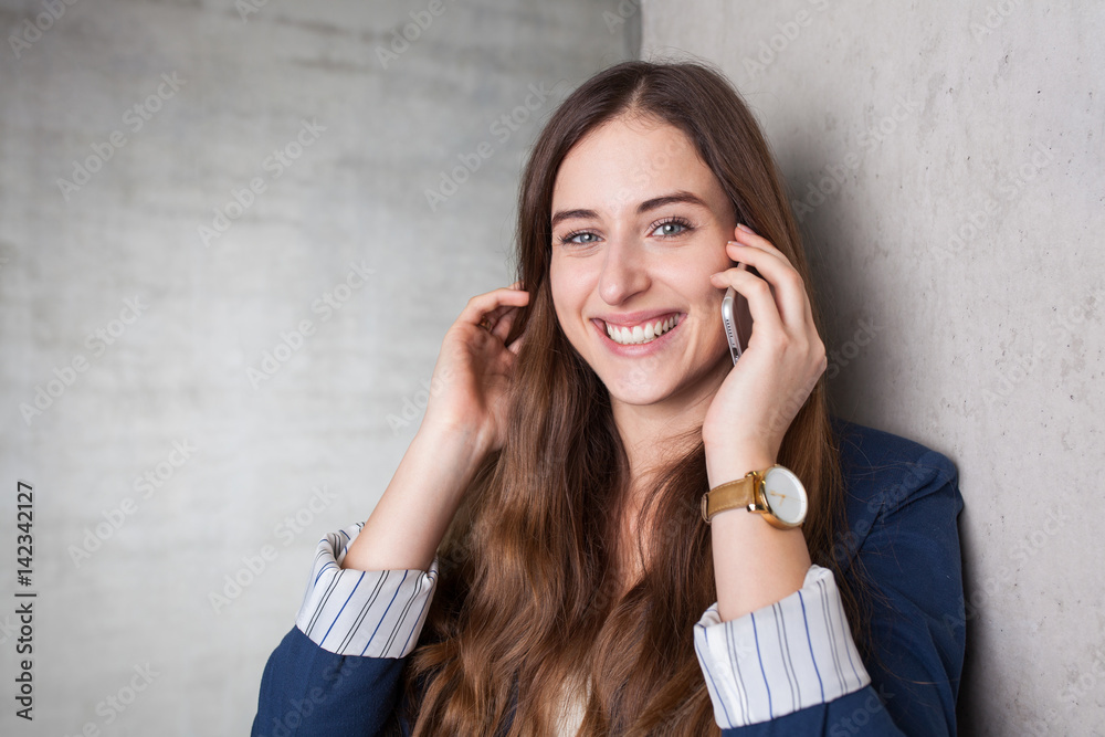 woman with smartphone smiling at you woman with smartphone smiling at you