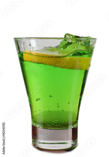 Glass cup with a cocktail and lemon on white background
