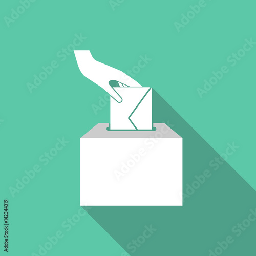 Long shadow hand inserting an envelope in a ballot box