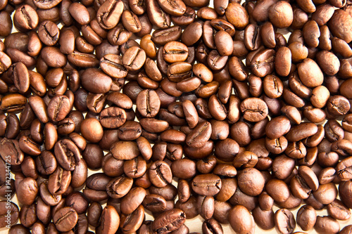 Coffee beans on wooden table