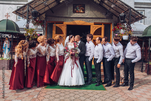 Wallpaper Mural bride and groom newlyweds with happy groomsmans and bridesmaids posing at church after luxury wedding ceremony Torontodigital.ca