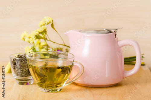 Cup of hot tea on wooden background, healthy drink