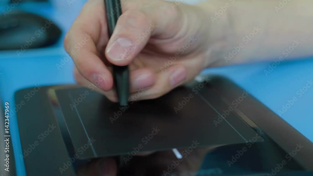 Designer working with Drawing tablet for computer Designer working with Drawing tablet for computer