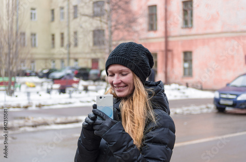 Woman with mobile phone in the city