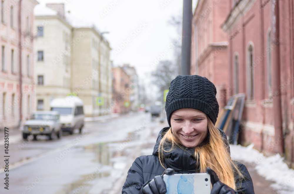 Woman with mobile phone in the city Woman with mobile phone in the city