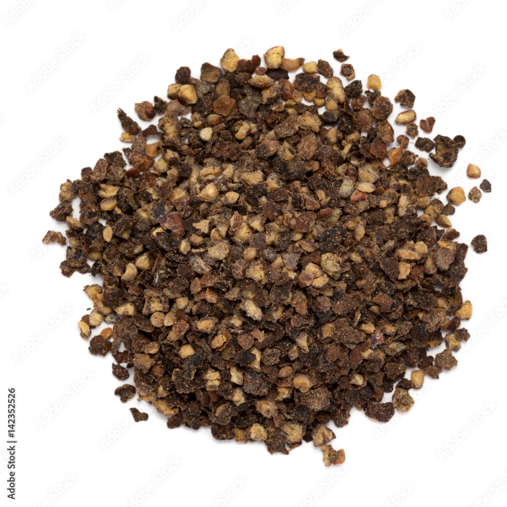 Dried Organic and cracked Black peppercorns (Piper nigrum) isolated on white background for Infused Tea. Macro closeup. Top view. Dried Organic and cracked Black peppercorns (Piper nigrum) isolated on white background for Infused Tea. Macro closeup. Top view.