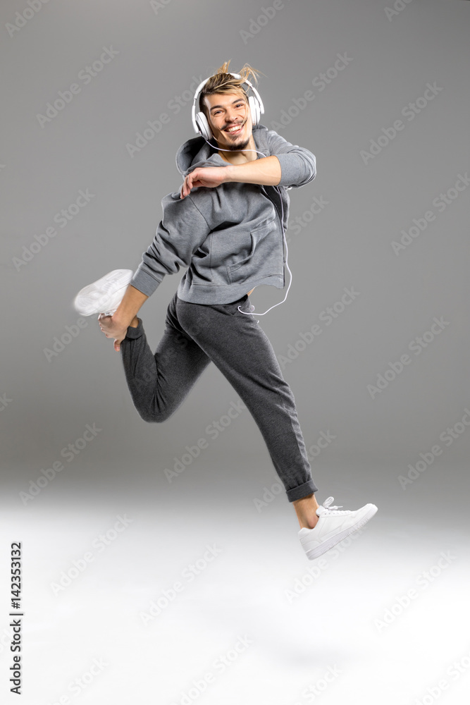 Man in headphones jumping