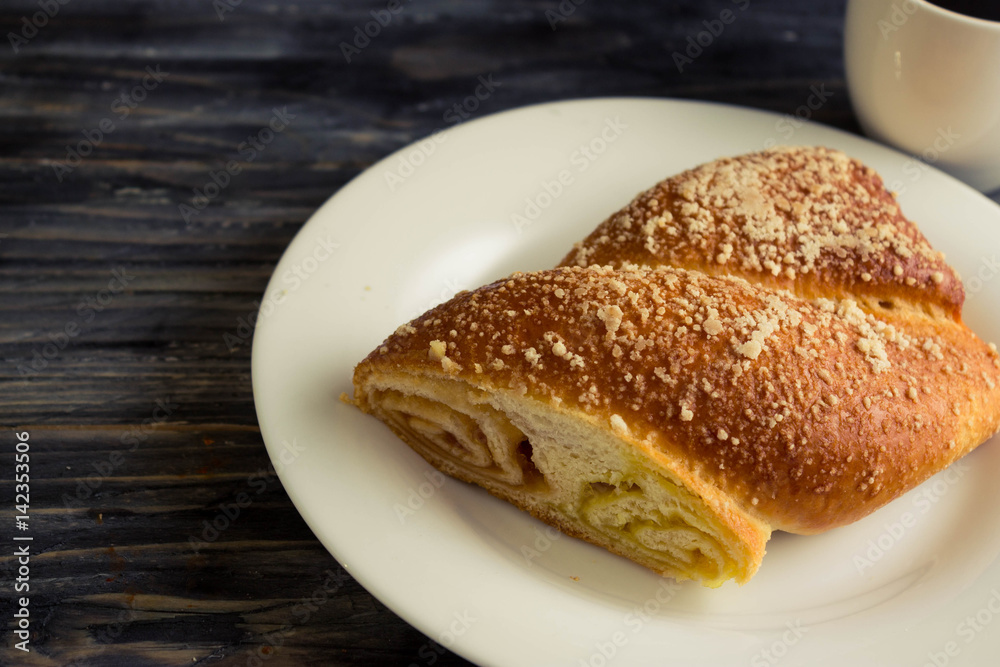 Austrian strudel with lemon and orange jam on a wooden table in rustic style