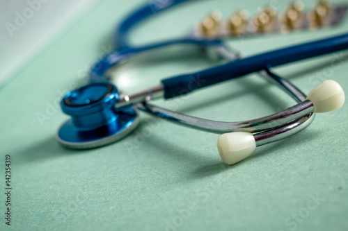 A stethoscope on a textured background, blur photo