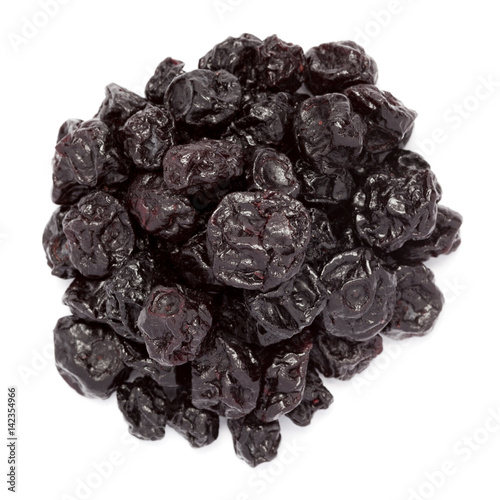 Organic air dried Blackcurrant (Ribes nigrum) berries isolated on white background. Macro closeup. Top view.