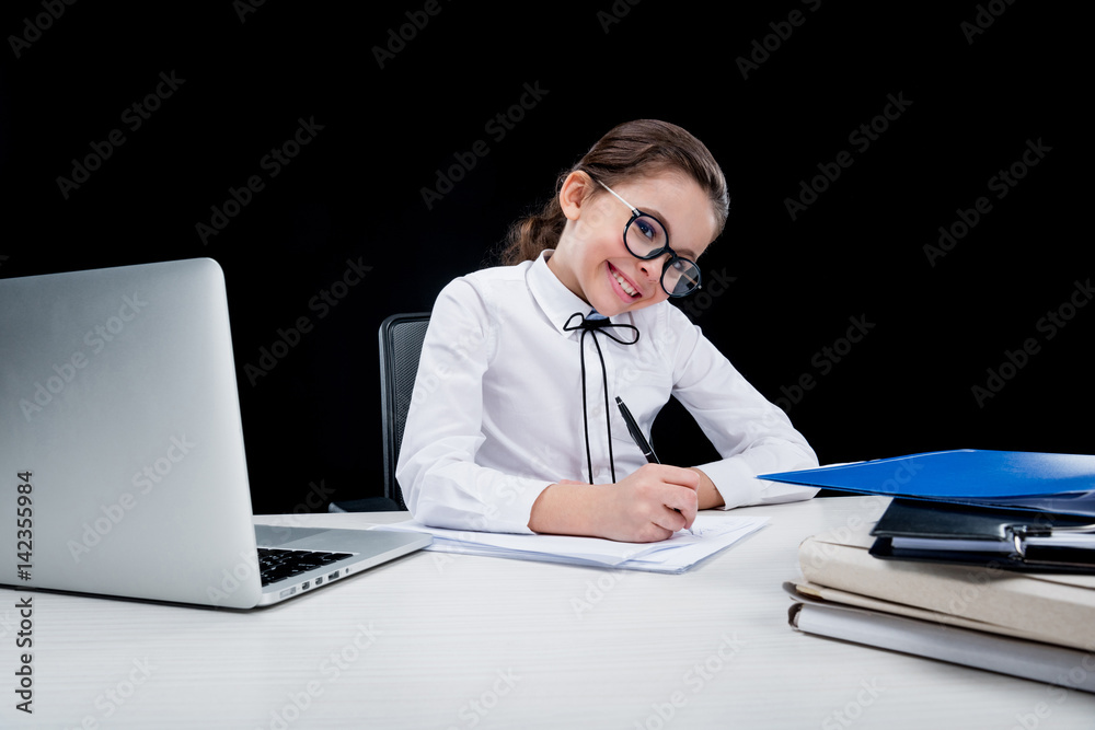 Girl working with documents at workplace on black Girl working with documents at workplace on black