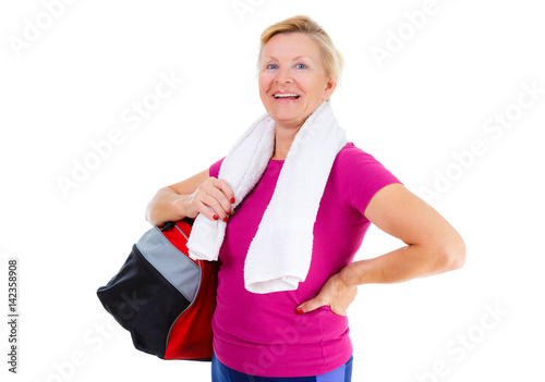 Pensioner woman sport. Happy of Senior old woman with sport bag on shoulder and towel around neck in sport outfit after exercising fitness in gym holding, isolated on white, Positive emotions