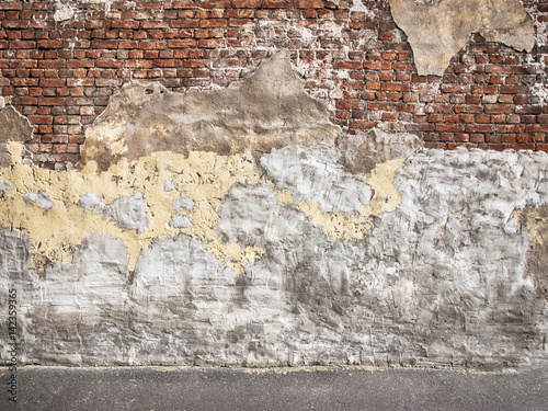 Old brick wall with peeling...
