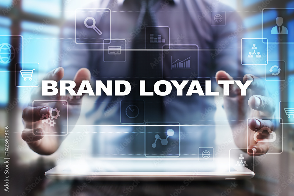 Businessman using tablet pc and selecting brand loyalty. Businessman using tablet pc and selecting brand loyalty.