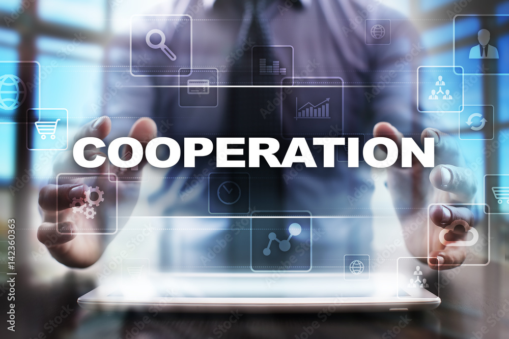 Businessman using tablet pc and selecting cooperation.