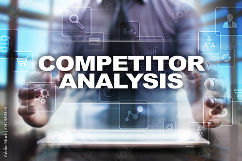 Fotografie Businessman using tablet pc and selecting competitor analysis.