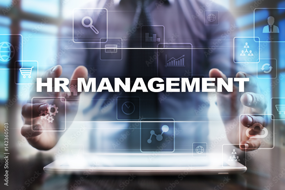 Businessman using tablet pc and selecting hr management.