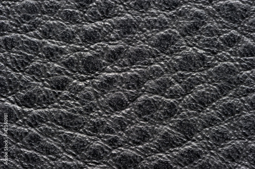 Black leather for manufacturing of shoes, clothes, bags and other fashion accessories, high quality natural seamless material sample, textured background, top view