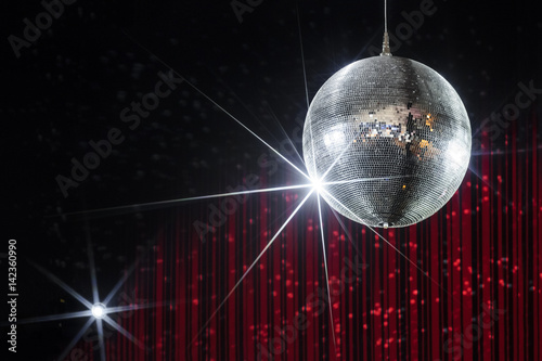 Party disco ball with stars in nightclub with striped red and black walls lit by spotlight, nightlife entertainment industry 