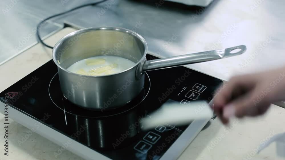 Milk and butter are heated in a saucepan