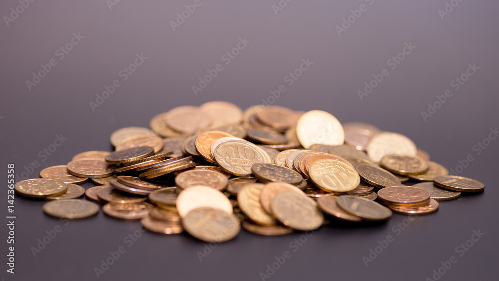a scattering of coins on a black background a scattering of coins on a black background