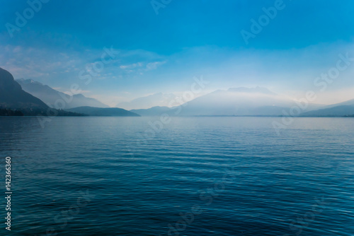 Fog on mountains at Annecy lake in France