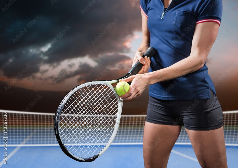 Tennis player on court with evening sky