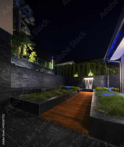 zen garden with a fountain at night, nobody