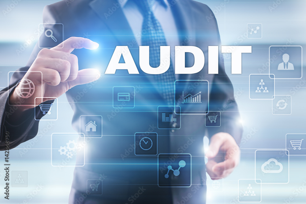 Businessman selecting audit on virtual screen. Businessman selecting audit on virtual screen.