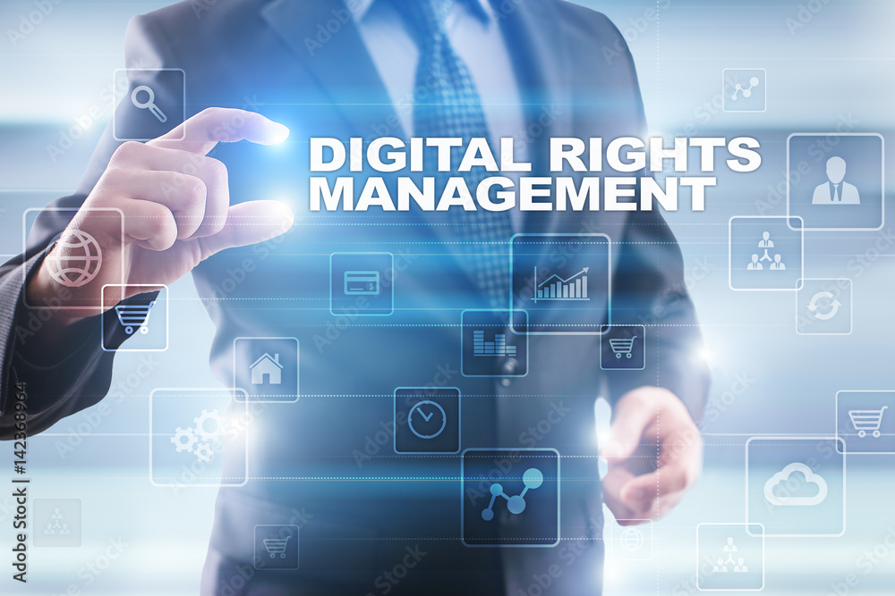 Obraz premium Businessman selecting digital rights management on virtual screen.