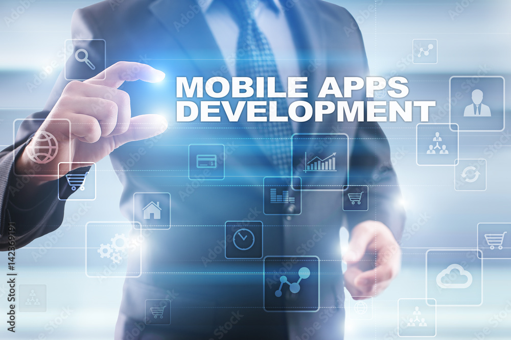 Businessman selecting mobile apps development on virtual screen. Businessman selecting mobile apps development on virtual screen.