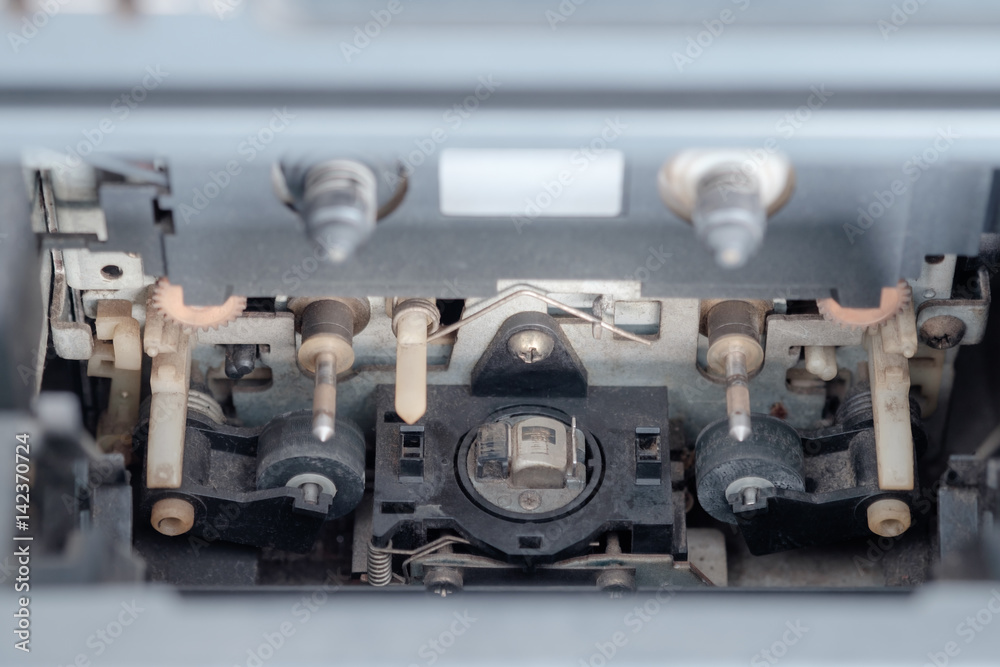 Cassette player / View of old and dirty cassette player. Inside of radio.