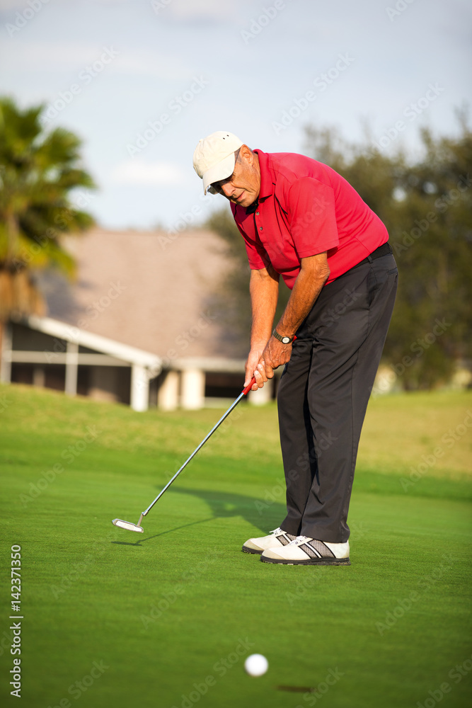 Fototapeta premium Senior man putting