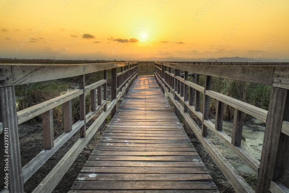 Wooden bridge with sunset sky in twilight at Sam Roi Yot National Park,Thailand