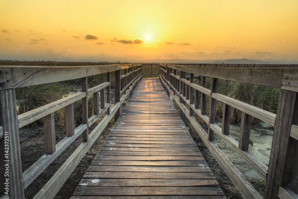 Wooden bridge with sunset sky in twilight at Sam Roi Yot National Park,Thailand Wooden bridge with sunset sky in twilight at Sam Roi Yot National Park,Thailand