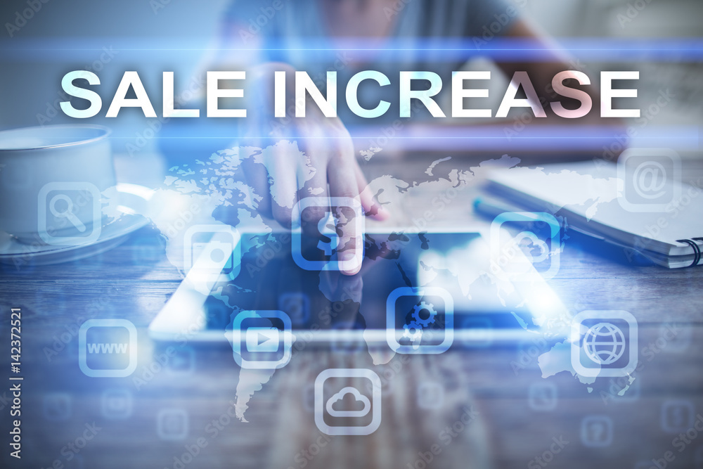 Woman using tablet pc, pressing on virtual screen and selecting sale increase. Woman using tablet pc, pressing on virtual screen and selecting sale increase.